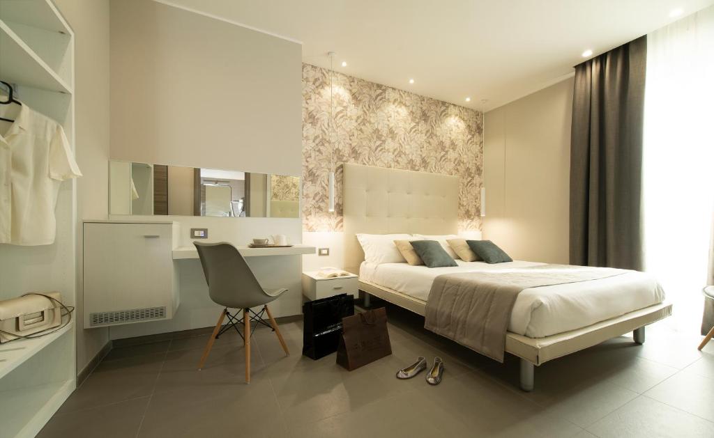 Postel nebo postele na pokoji v ubytování Hotel H21