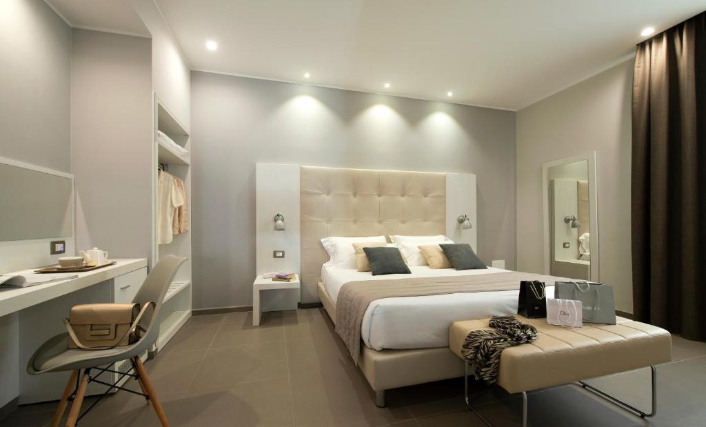 Postel nebo postele na pokoji v ubytování Hotel H21