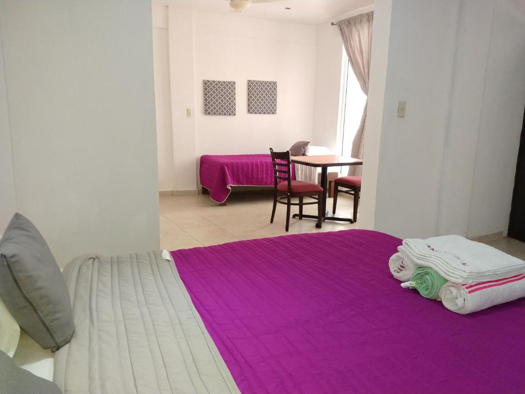Postel nebo postele na pokoji v ubytování Hotel España
