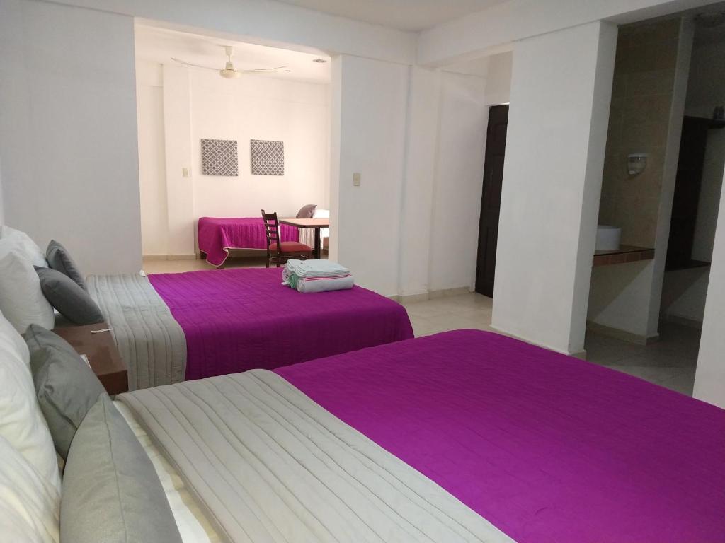 Postel nebo postele na pokoji v ubytování Hotel España