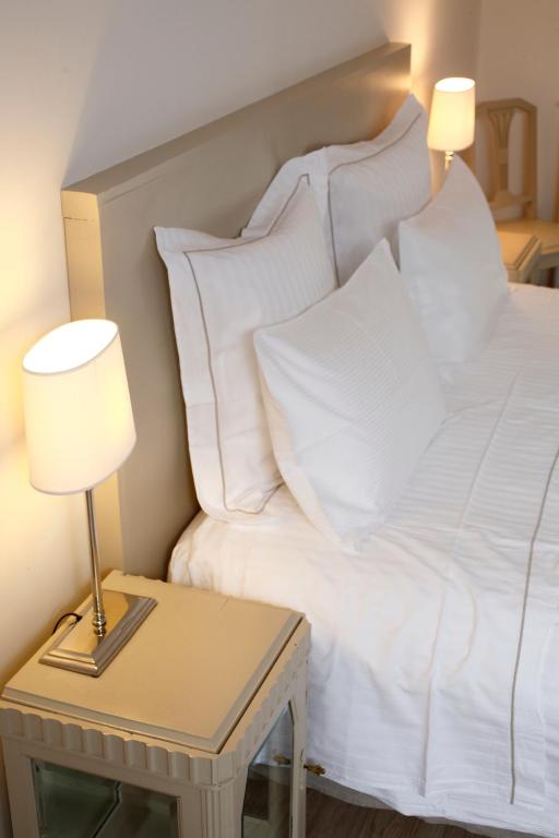 Postel nebo postele na pokoji v ubytování Auberge Du Paradis