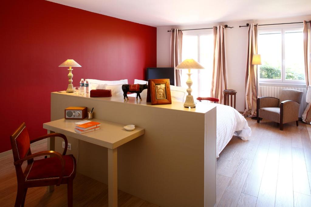 Postel nebo postele na pokoji v ubytování Auberge Du Paradis