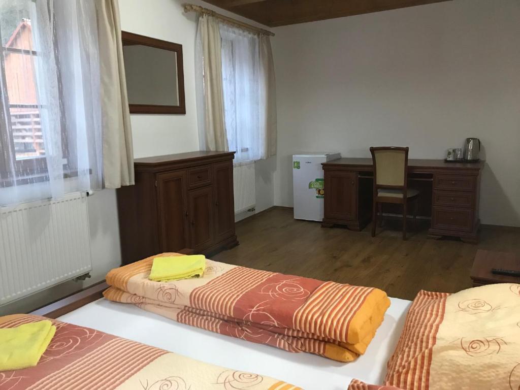 Postel nebo postele na pokoji v ubytování Zevlův mlýn