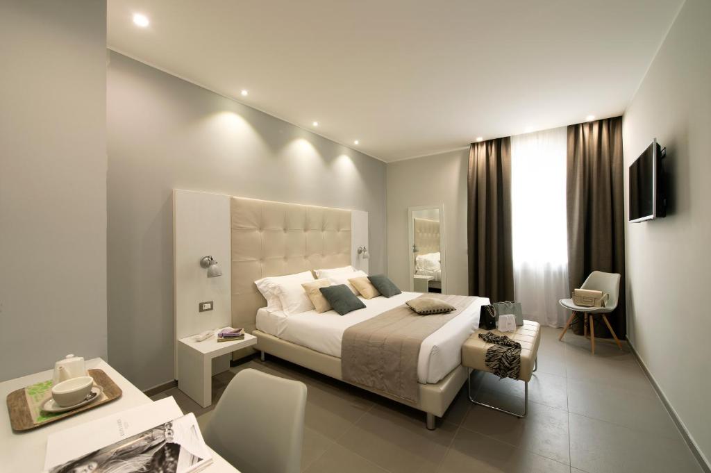 Postel nebo postele na pokoji v ubytování Hotel H21