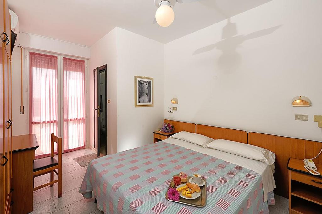 Postel nebo postele na pokoji v ubytování Hotel Samoa