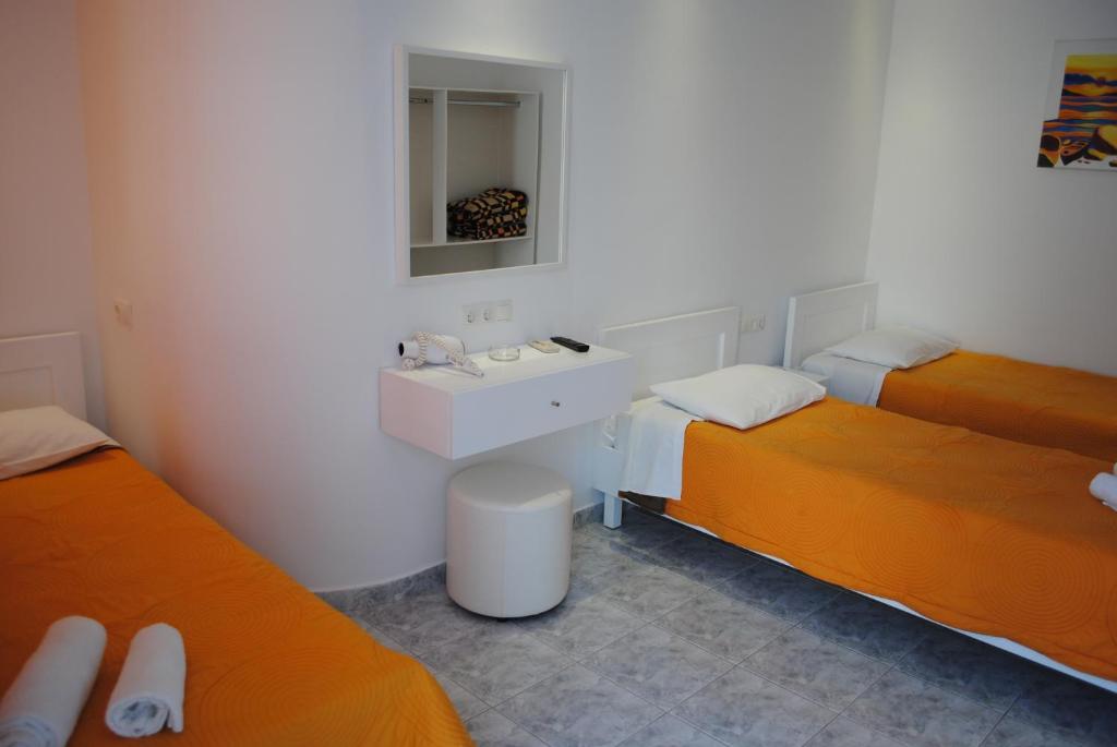 Postel nebo postele na pokoji v ubytování Hotel Milena