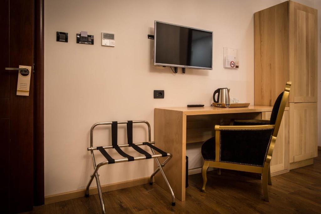 TV a/nebo společenská místnost v ubytování GARNI HOTEL ATRIUM