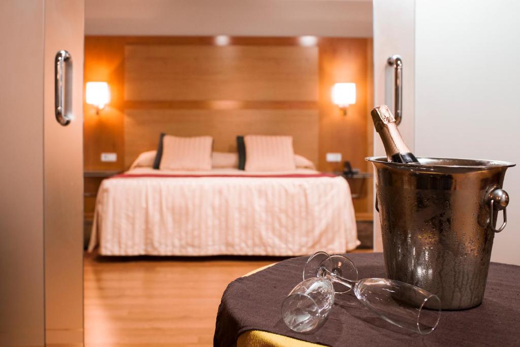 Postel nebo postele na pokoji v ubytování Hotel Reconquista