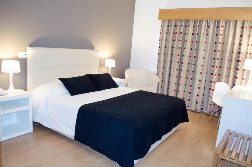 Postel nebo postele na pokoji v ubytování Hotel Durao