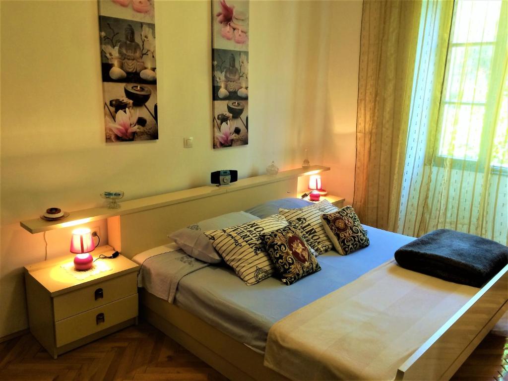 Łóżko lub łóżka w pokoju w obiekcie Noemi City Apartments