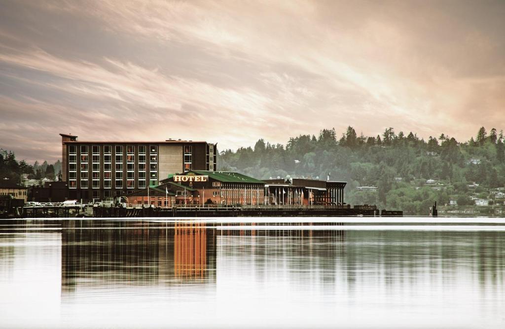 a hotel sitting next to a large body of water at The Mill Casino Hotel in North Bend