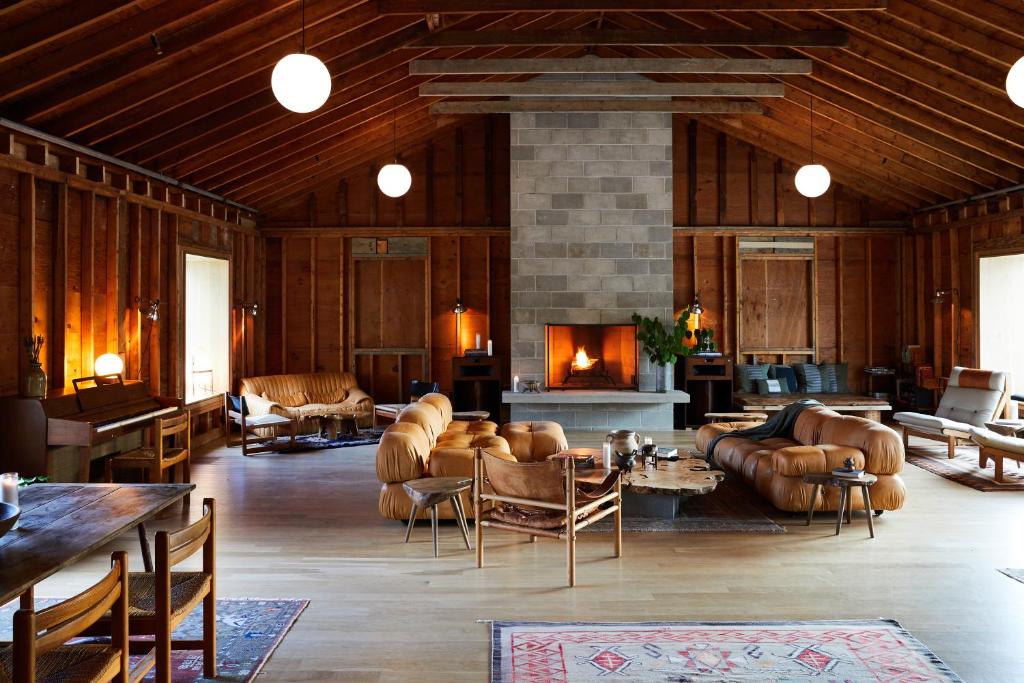 a living room with leather furniture and a fireplace at Tourists in North Adams