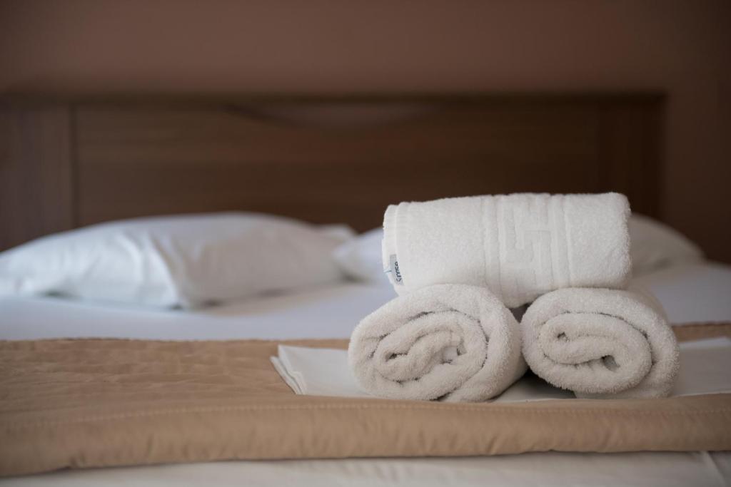 Postel nebo postele na pokoji v ubytování Sun Rise Hotel Apartments