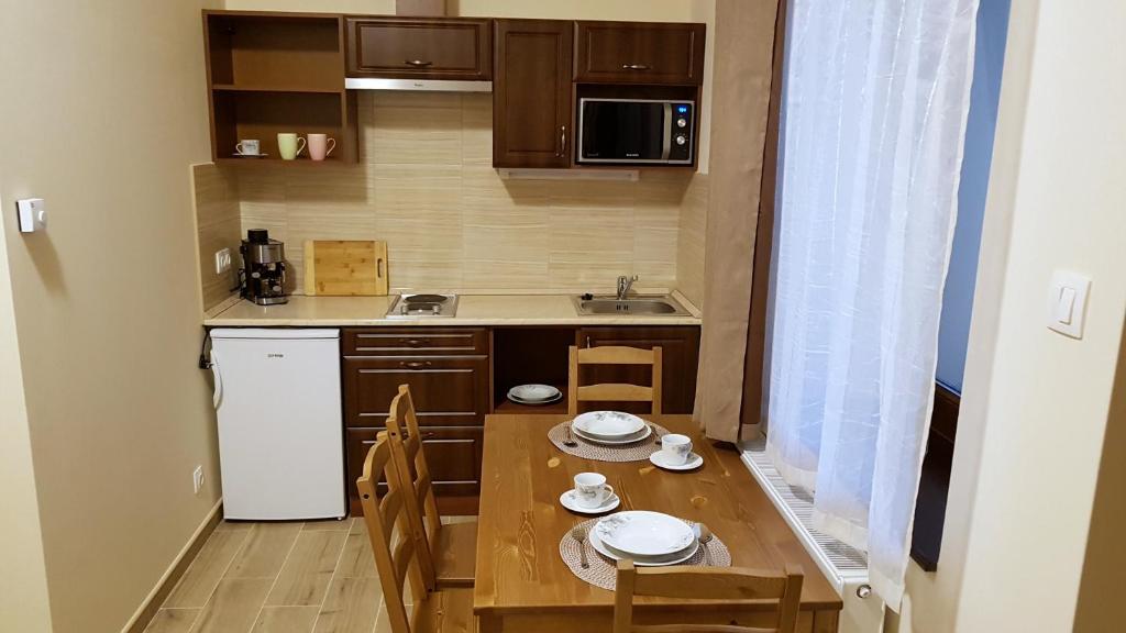 Kuchyňa alebo kuchynka v ubytovaní Toscana Apartman