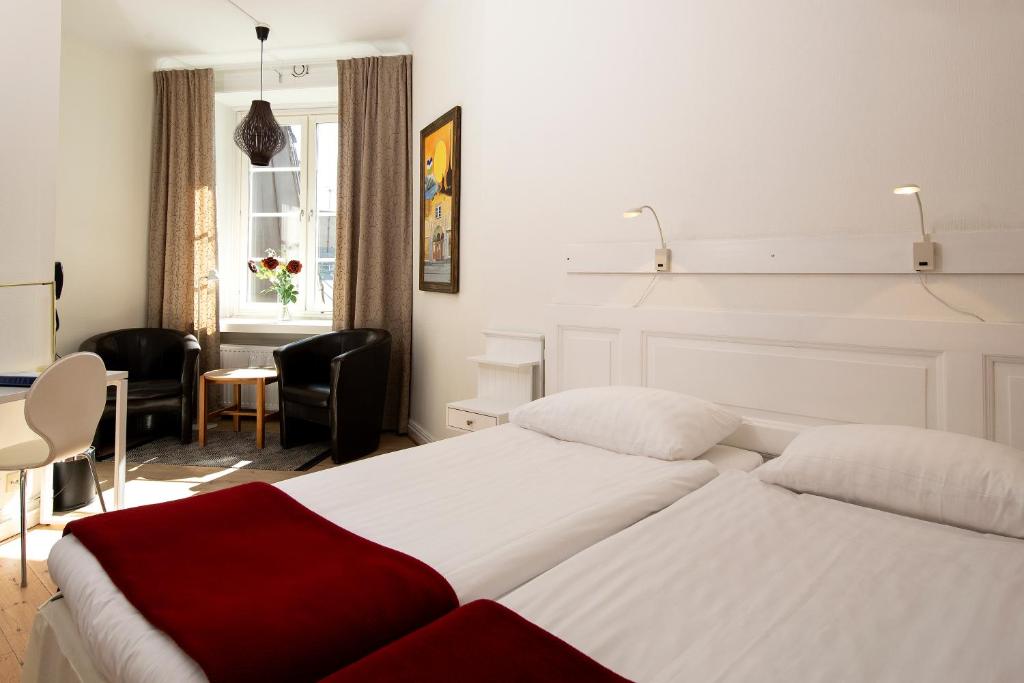 Postel nebo postele na pokoji v ubytování Hotel Emma
