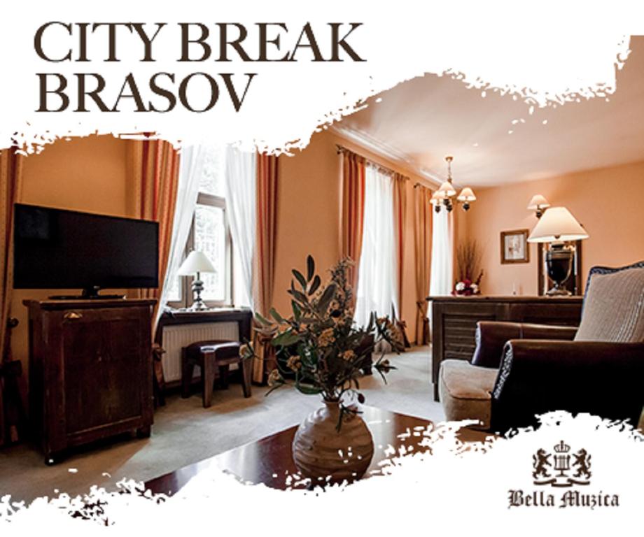 a living room with a couch and a tv at Hotel Bella Muzica in Braşov