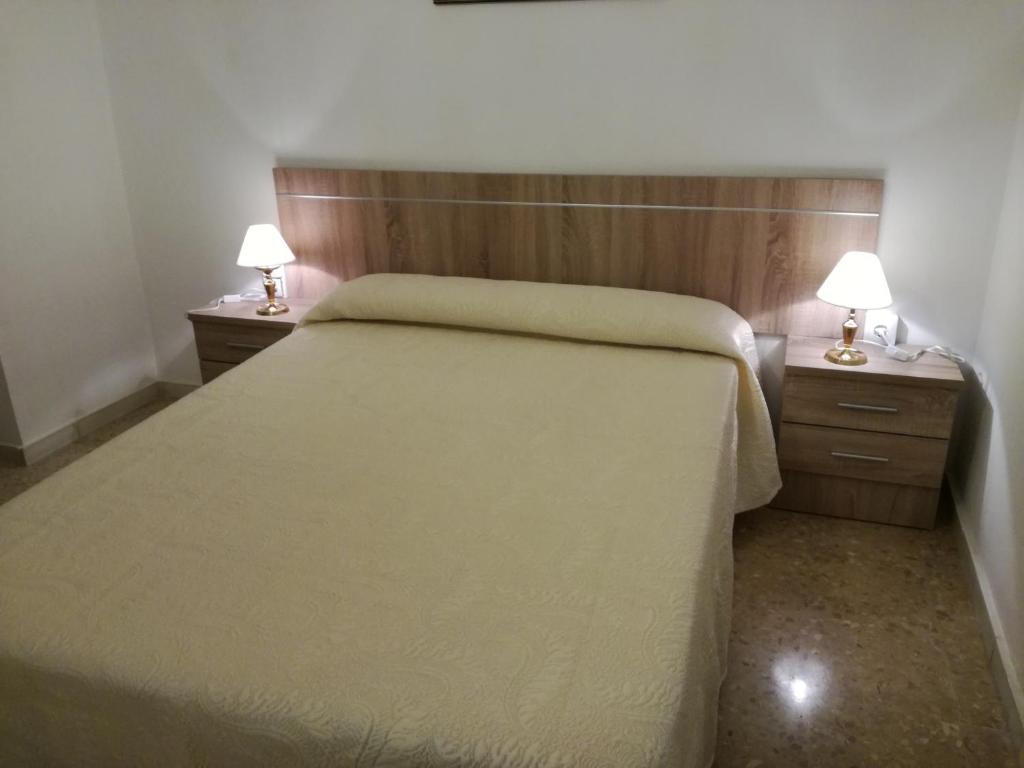 Postel nebo postele na pokoji v ubytování VIVIENDA COMPLETA EN SEVILLA