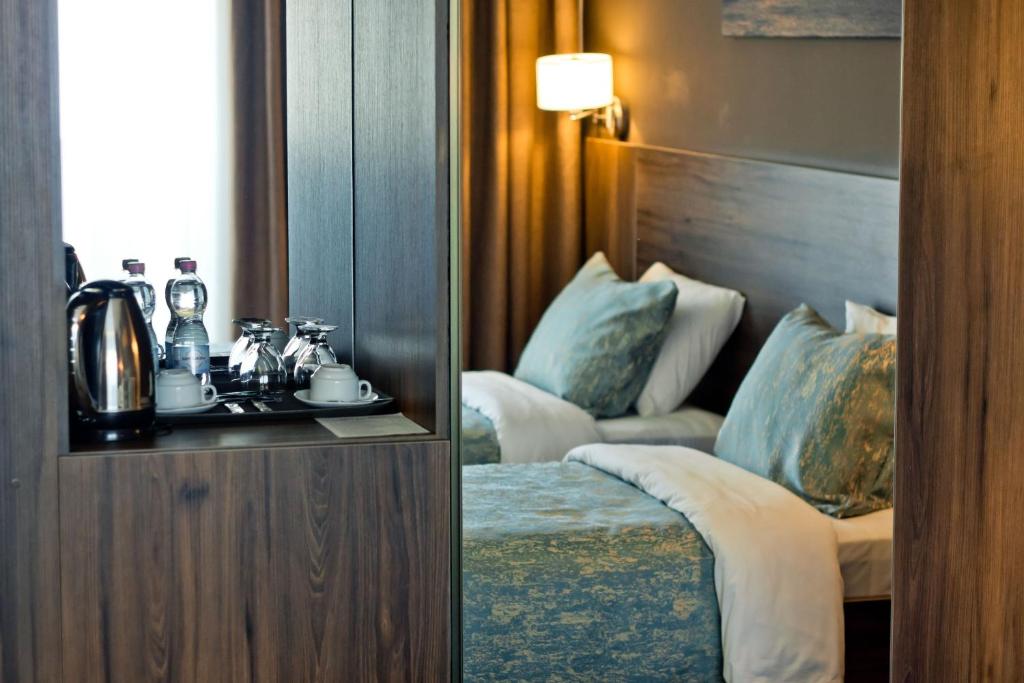 Postel nebo postele na pokoji v ubytování Sky Inn Batumi