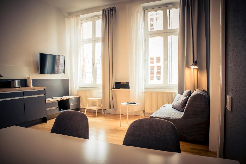 TV a/nebo společenská místnost v ubytování Schwerin City Apartment