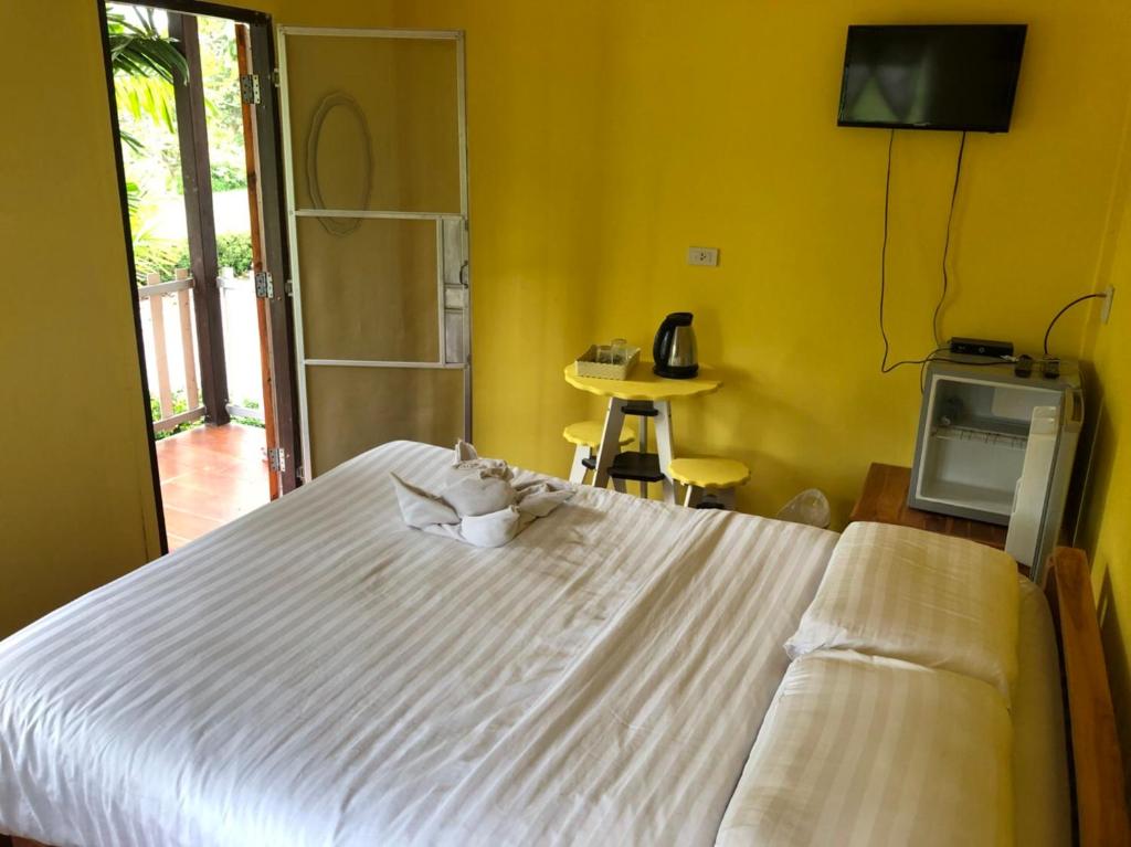 Postel nebo postele na pokoji v ubytování Sukhothai Indy Resort