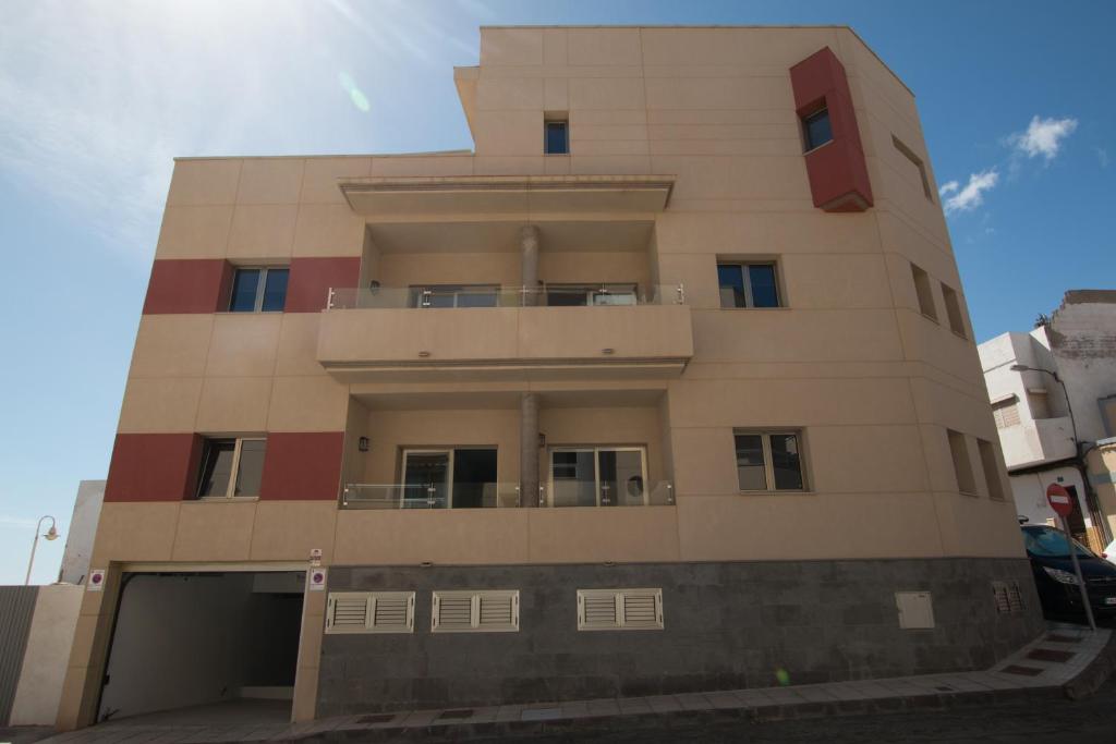 a tallartment building with a building at Edificio Arinaga Golden in Arinaga