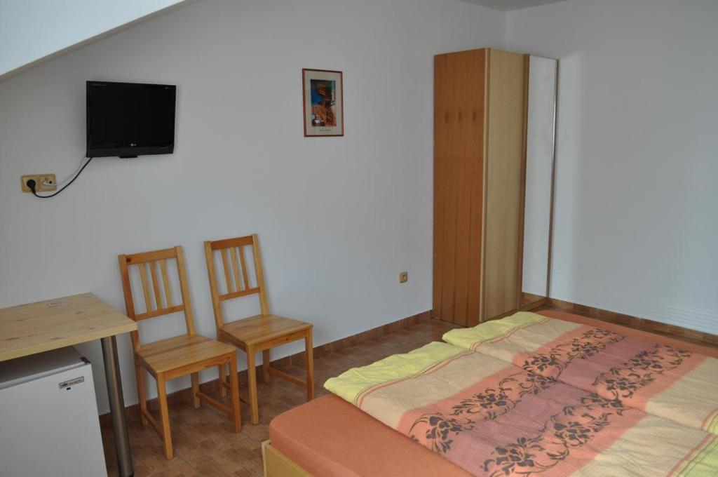 Postel nebo postele na pokoji v ubytování Penzion U Zamku