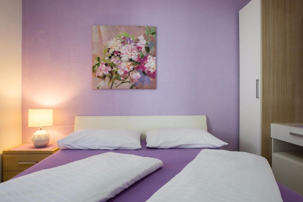 Postel nebo postele na pokoji v ubytování Apartments "Villa Antea"