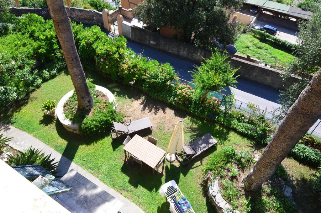 an overhead view of a garden with a bench and umbrella at Villa Margherita in Levanto