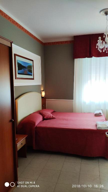 Кровать или кровати в номере Hotel Minerva
