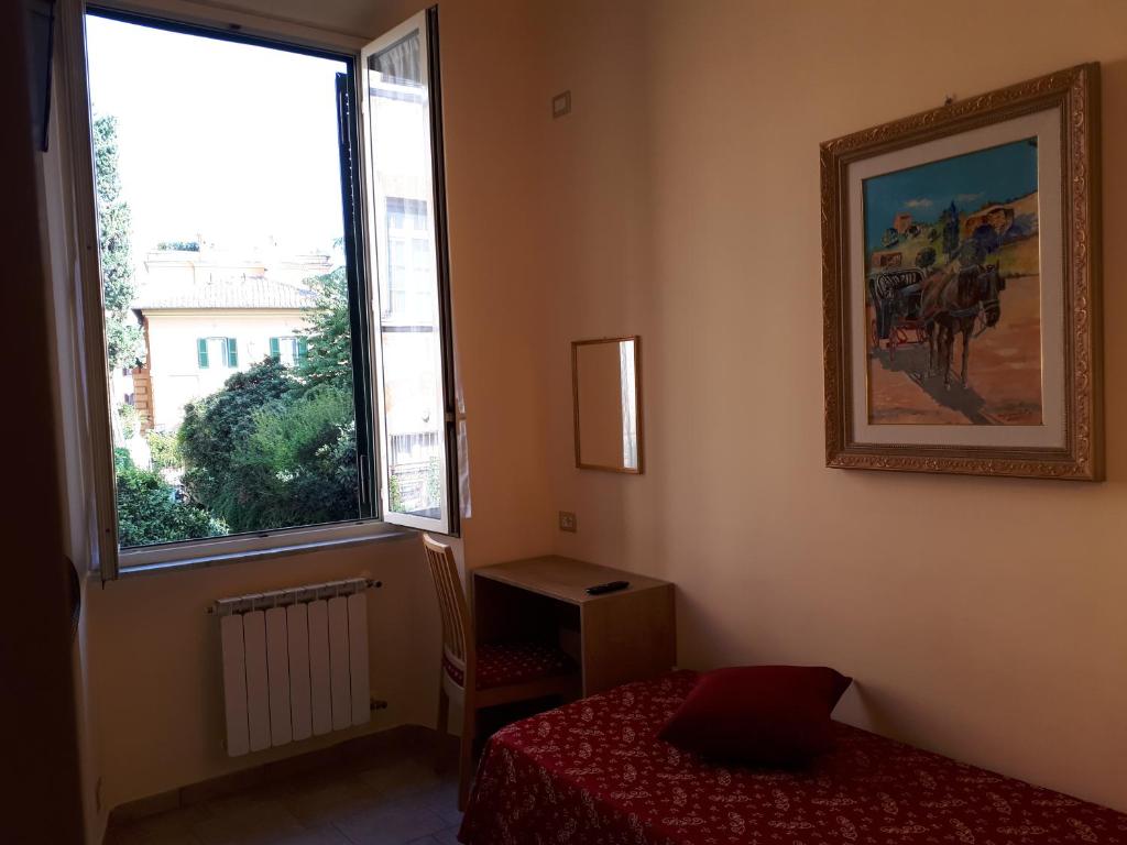 Una cama o camas en una habitación de Hotel Major Aventinus