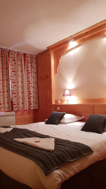 Postel nebo postele na pokoji v ubytování Cit'Hôtel le Welcome