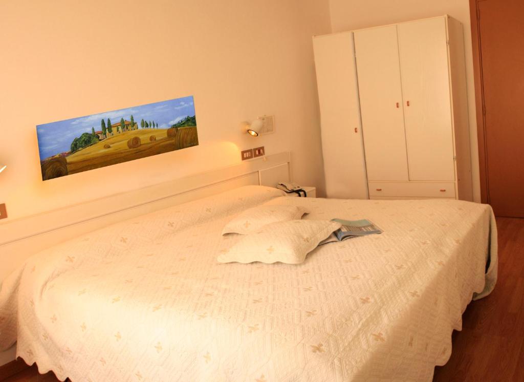 Postel nebo postele na pokoji v ubytování Hotel Aggravi