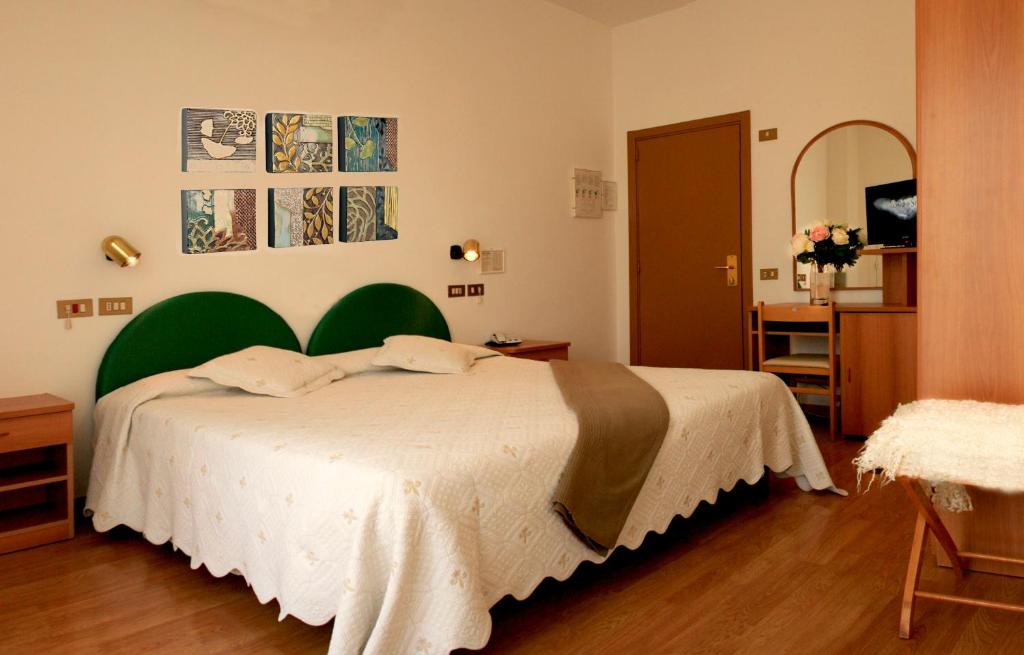 Postel nebo postele na pokoji v ubytování Hotel Aggravi