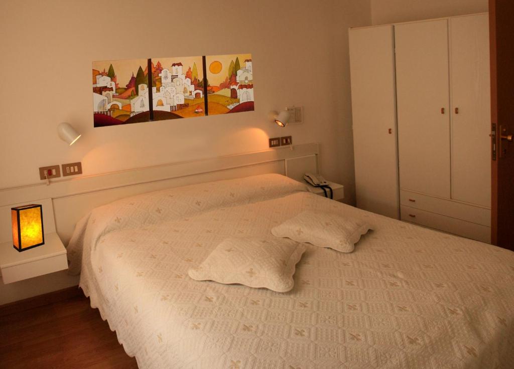 Postel nebo postele na pokoji v ubytování Hotel Aggravi