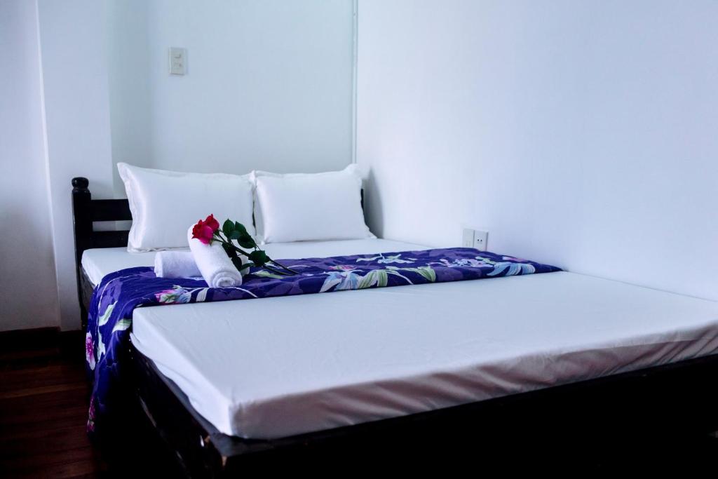 Tempat tidur dalam kamar di Thanh An 2 Guesthouse