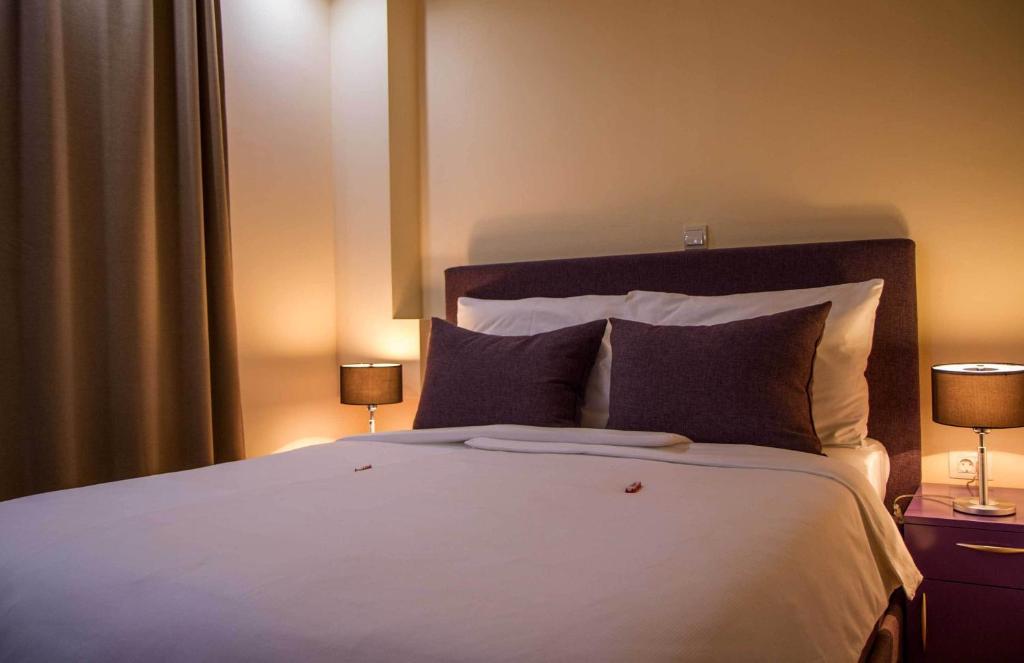 Postel nebo postele na pokoji v ubytování Hotel M