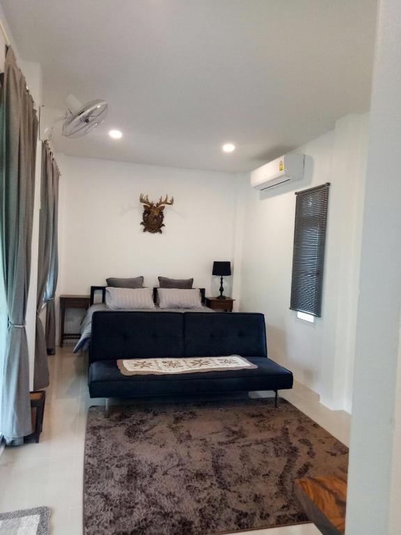 Postel nebo postele na pokoji v ubytování ComeHome Lamphun