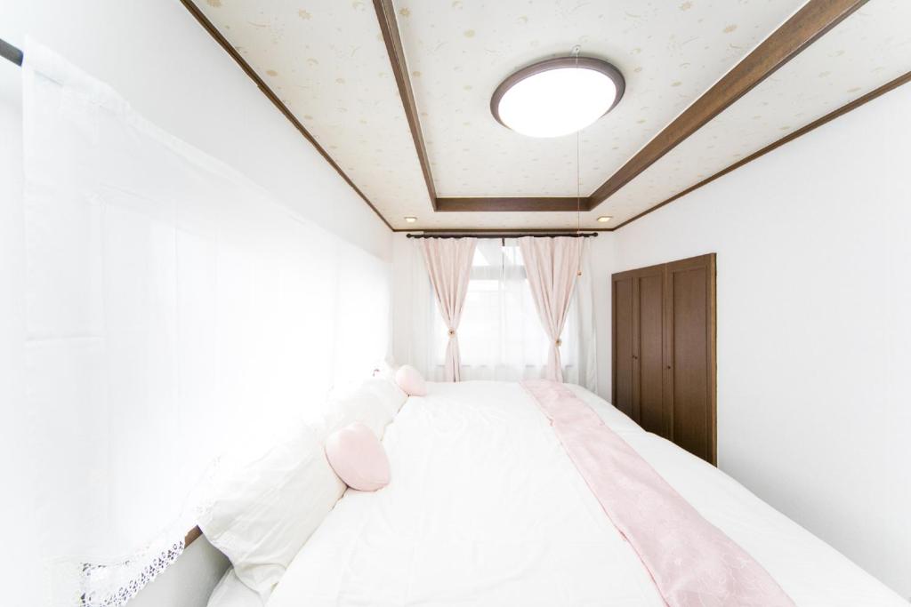 Letto o letti in una camera di Miraie Yokkaichi Kitahamacho