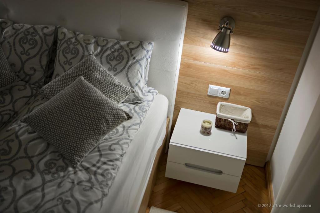 Postel nebo postele na pokoji v ubytování Apartment ART