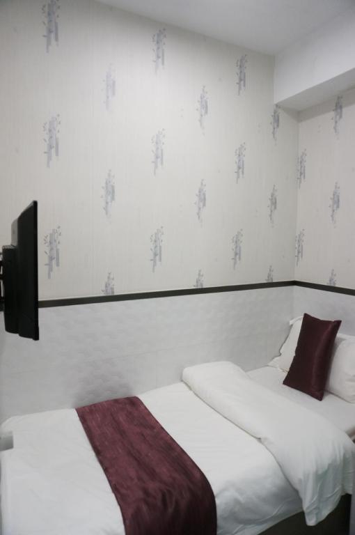 Katil atau katil-katil dalam bilik di Vve Vve Hotel