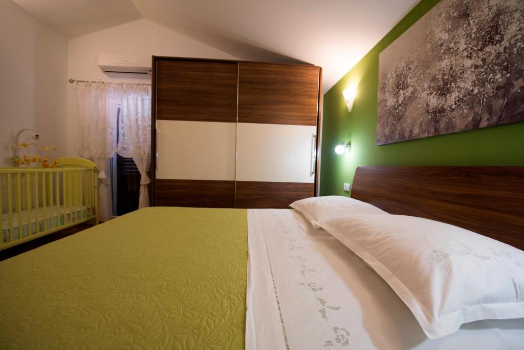 Postel nebo postele na pokoji v ubytování Villa Ivana