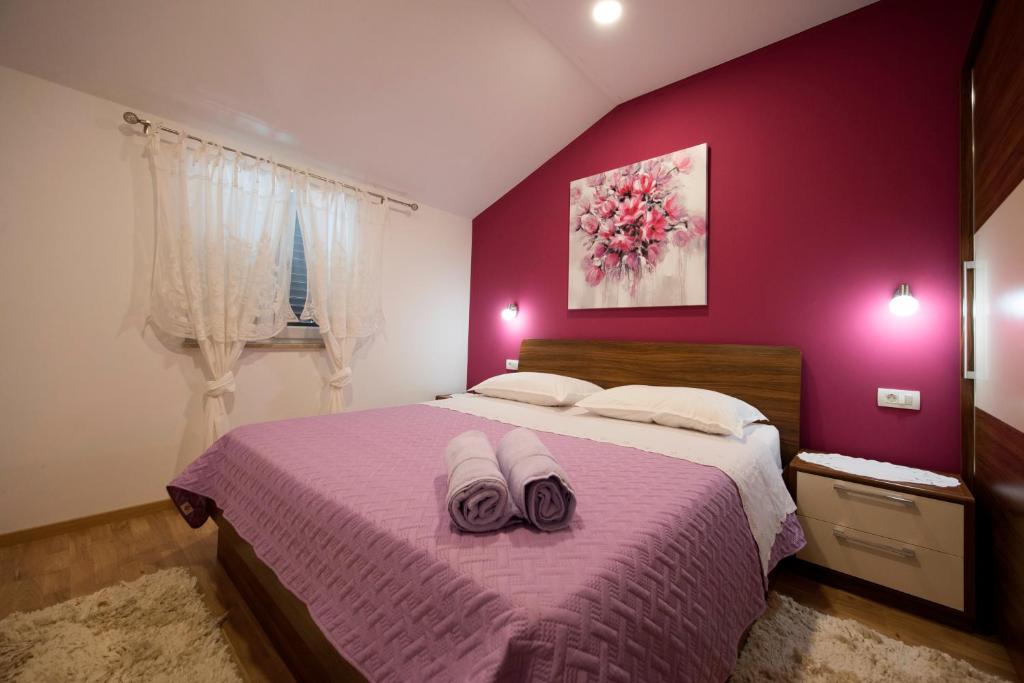 Postel nebo postele na pokoji v ubytování Villa Ivana