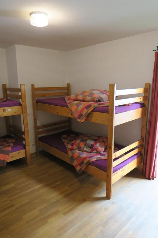 Postel nebo postele na pokoji v ubytování SnowBunnys BackPackers Hostel