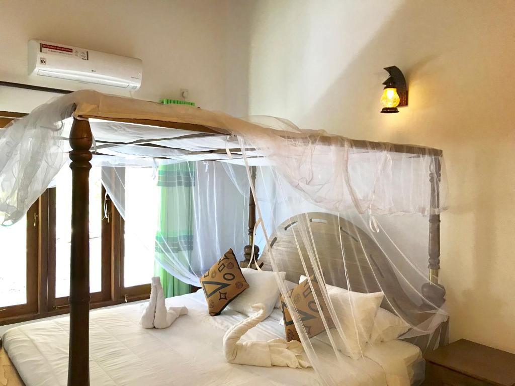 Postel nebo postele na pokoji v ubytování Aki Villa