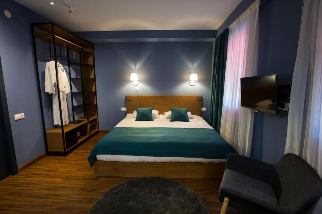 Postel nebo postele na pokoji v ubytování Elle Boutique Hotel