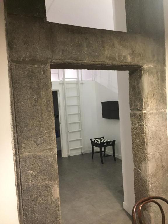 Televízia a/alebo spoločenská miestnosť v ubytovaní CosyHomeSuite Napoli