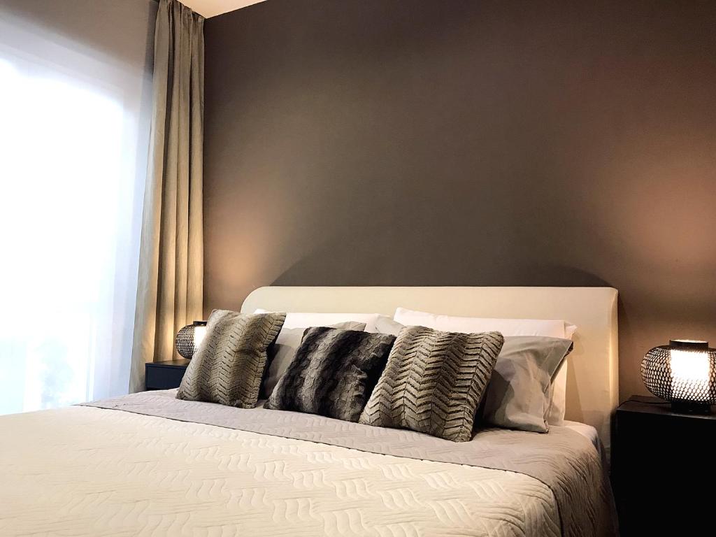 A bed or beds in a room at VILLA MARRONE - Relais -