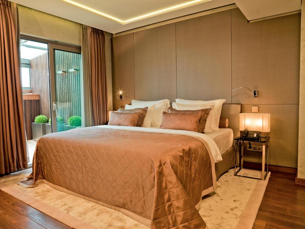 a bedroom with a large bed in a room at Lasagrada Hotel Istanbul in Istanbul