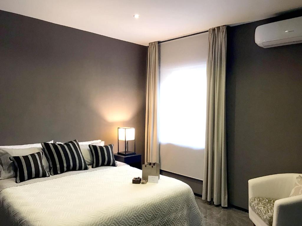 A bed or beds in a room at VILLA MARRONE - Relais -