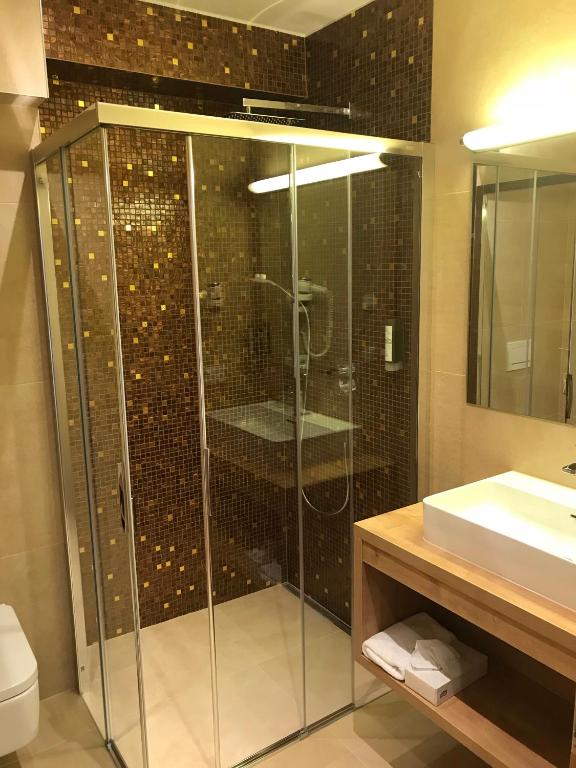 Koupelna v ubytování Berger's Sporthotel